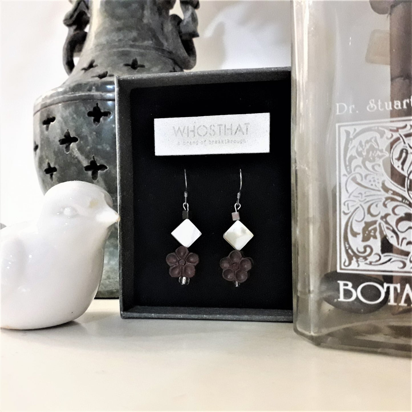 Scented black sandal wood blossom flower and shell ear pins