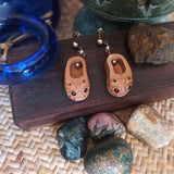 Pair of sterling silver ear studs drop earrings of crafted peach wood mini size chinese style toddler shoes with traditional lion head pattern shoe toe.