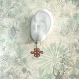 925 silver ear wire drop earrings aroma diffuser features a peach wood crafted oriental lucky knot displays on an ear model

