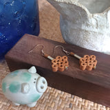 Pair of sterling silver ear wire drop earrings with peach wood crafted mini chinese knot motif is an aroma diffuser on-the-go