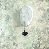 925 silver drop earrings features black sandal wood crafted oriental cloud form, tiny bronze and white bead, displays on an ear model