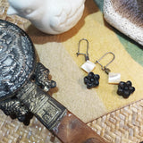 Pair of black and white 925 silver dangle earrings features a black sandal wood crafted oriental blossom flower and tiny white square mother-of-shell 