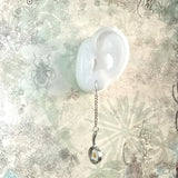 925 silver ear wire dangle earrings elongated by tiny metal chain, carries a doll size metallic frying pan display on an ear model