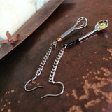 Two sterling silver ear wire dangle earrings is composed of delicate metal chain elongation, lifelike miniature soup ladle and egg whisk