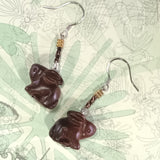 Close-up of 925 silver ear wire dangle earrings featured by a mini red sandal wood crafted Chinese rabbit is an aroma diffuser