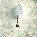 Black sandal wood crafted chinese eggplant form dingle bell 925 silver ear stud dangle earrings elongated by gun metal color mini chain display on an ear model