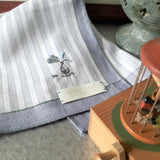 Zen style grey and white stripe cotton handkerchief hand embroidered a delicate vase and plant motif at the corner.