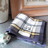 Well-made grey tartan check cotton handkerchief with yellow stripe and grey border, is hand embroidered a traditional Chinese tea set at the corner

