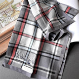 Well-made grey tartan plaid cotton handkerchief highlighted by red stripes, hand stitched a delicate oriental style boat and forest motif 