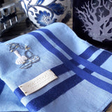 Sky blue cotton handkerchief with royal blue stripes border have a mini hand embroidery of Chinese tea setting and zen flower arrangement  
