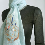 A baby blue pure linen scarf hand embroidered a big impresssionism thread work in various color and metal threads. 