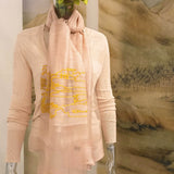 Soft and light coral color silk wool sheer scarf has a big thread art of oriental style landscape where old chinese lodge, groves, animals and streams are found.