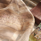 Sheer light camel color silk wool scarf featured by different size of stripes in coco color, and a big hand embroidery of chrysanthemum line art pattern.