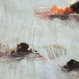 Light blue two-tone pure linen scarf with a hand-embroidered tree and bush pattern and  hand-felted wool island in black white and orange color.