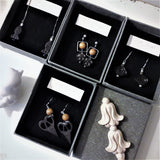 Aromatic ebony crafted auspicious cloud 925 silver ear pins