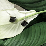 A pair of dangle earrings with ear wire in 925 silver, featured by a small black sandalwood crafted chinese auspicious cloud form 
