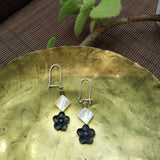 A tiny black sandal wood crafted blossom flower and tiny square mother-of-pearl forms a black-and-white feature of this pair of 925 silver dangle earrings 