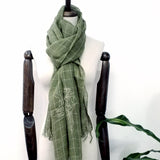 A green window-plaid linen scarf embroidered with a line art pattern delineate the story of a Chinese poem