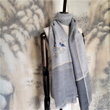 A grey 300s super fine cashmere shawl with beige velveteen stripe has a hand embroidery pattern of two blue birds and white flowers