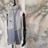 Light and middle grey super fine cashmere scarf hand embroidered a chinese style pattern of two birds singing on a branch of white blossoms flowers.