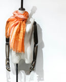 Orange color pure linen scarf with hand twisted tassels features a line art embroidery design of a spaceman getting lost in an old village.