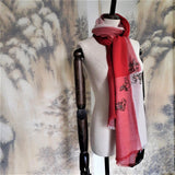 Soft red tone super fine cashmere shawl have four lively goldfishes line art embroidery is wrapped on the neck of mannequin